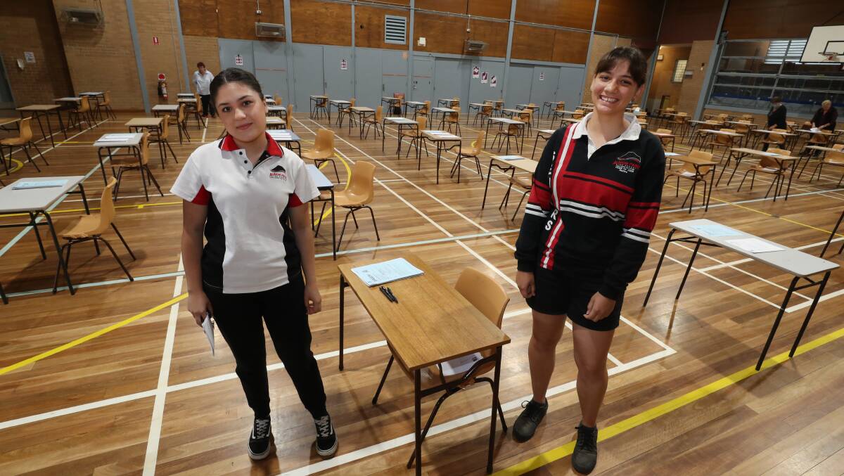 RELIEF: Albion Park High School students Lorena Ramirez and Hailee Pickering after doing the HSC English exam on Tuesday. Picture: Robert Peet