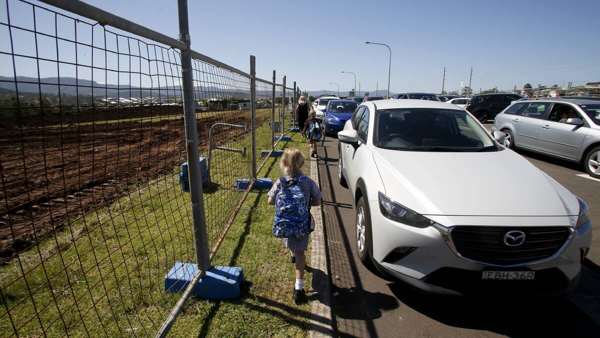 DANGEROUS: Fencing opposite Tullimbar Public School has made it difficult for pedestrians to enter and exit the school safely. Picture: Anna Warr