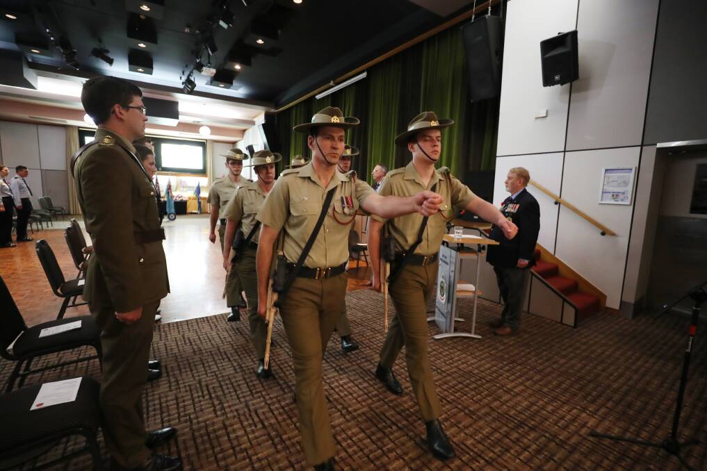 SYNCHRONISED: The catafalque party from 4/3 RNSWR 'dismounting' after the Remembrance service. Picture: Robert Peet