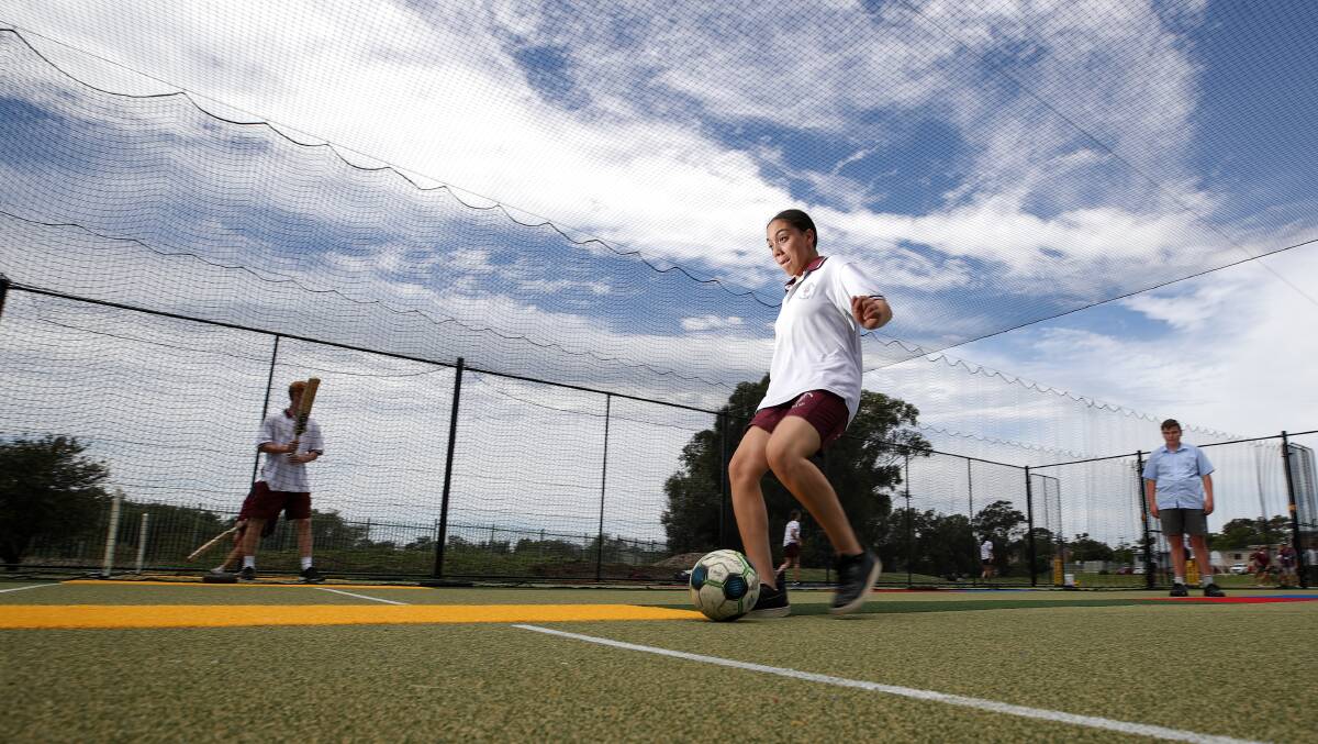 MULTI-PURPOSE: Holy Spirit College student Bianca Tucci tries out the Bellambi-based school's new multi-purpose, all-weather sports facility. Picture: Adam McLean.