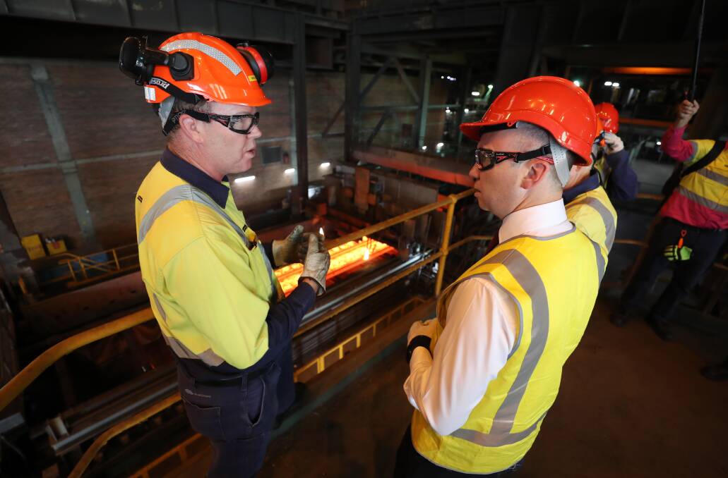 New deal: NSW Energy Minister Matt Kean (right) talking with BlueScope slab making manager Wayne Staff during a tour of the Port Kembla steelworks. Picture: Robert Peet