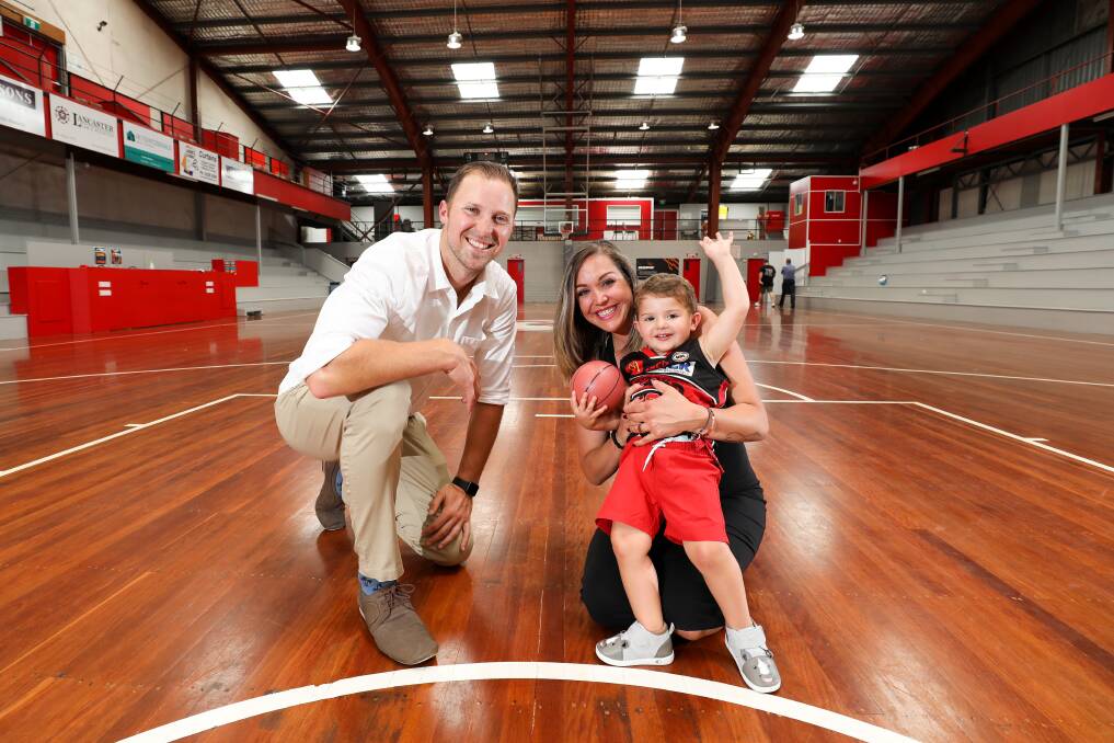 CURTAIN CALL: Hawks stalwart Tim Coenraad, with wife Nellie and son Tyson, announced his retirement from professional basketball at the Snakepit on Friday. Picture: Adam McLean.