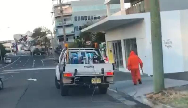WEED PATROL: A Wollongong City Council worker spraying weeds in the city's CBD.