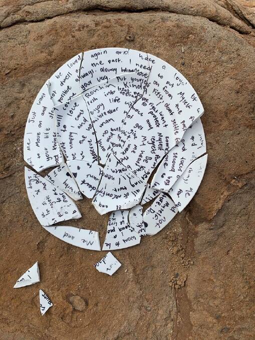 LEAVING IT BEHIND: The annotated and smashed plate found near the old women's pools at Flagstaff Hill. Picture courtesy Ben Potter.