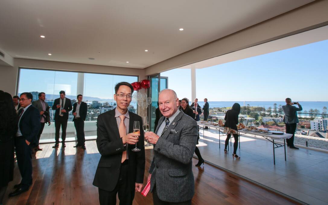 Toast: Developer Robert Hoang and Wollongong Lord Mayor Gordon Bradbery in the freshly minted penthouse of Oxford on Crown. 
Picture: Adam McLean