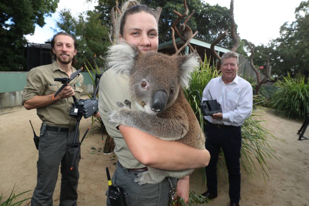 Jarrad Prangell and Zoe Ridge from Symbio and Peter Baker of South32 with a koala and drone as the conservation project was launched in March. Picture: Robert Peet