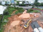 The 'Seacliff' townhouse construction site at Wombarra from above. Runoff was washed across the road, through private properties, onto the ocean rock ledge. Picture: DAVID CORBETT.
