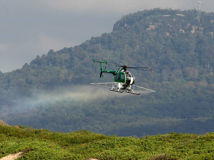 ROUNDOFF: Aerial spraying over East Corrimal Reserve in 2008 drew protests.