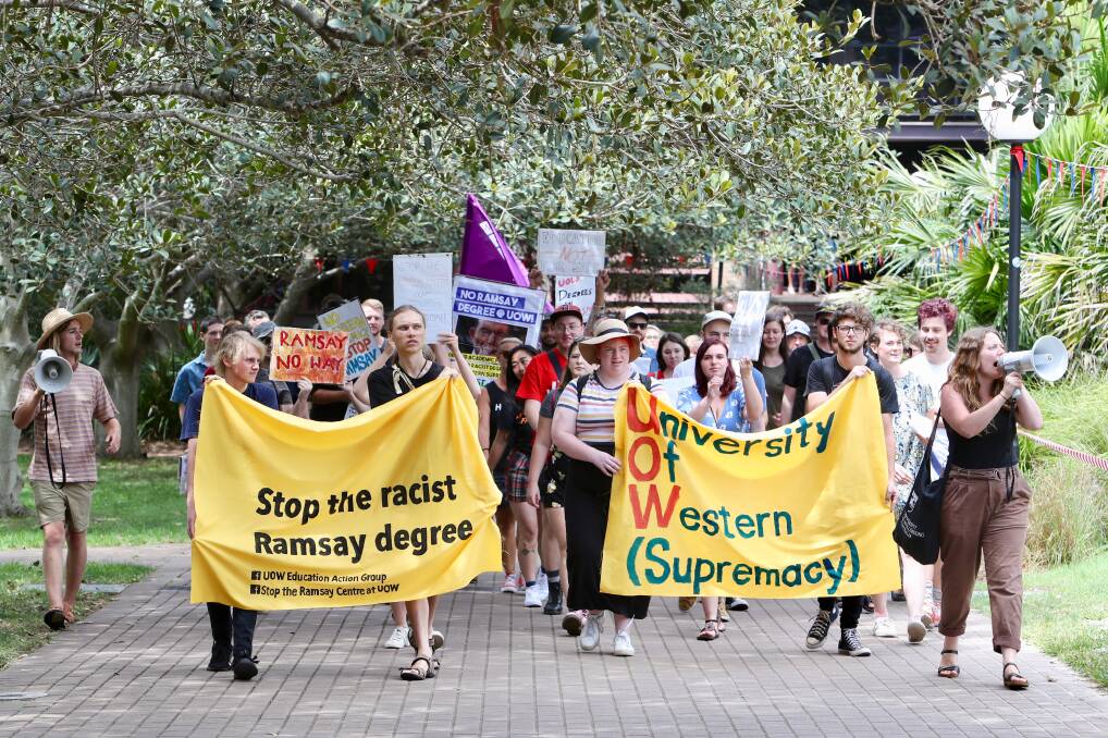 THE SHORT MARCH: Students take their message to the University of Wollongong administration building. Picture: Adam McLean.