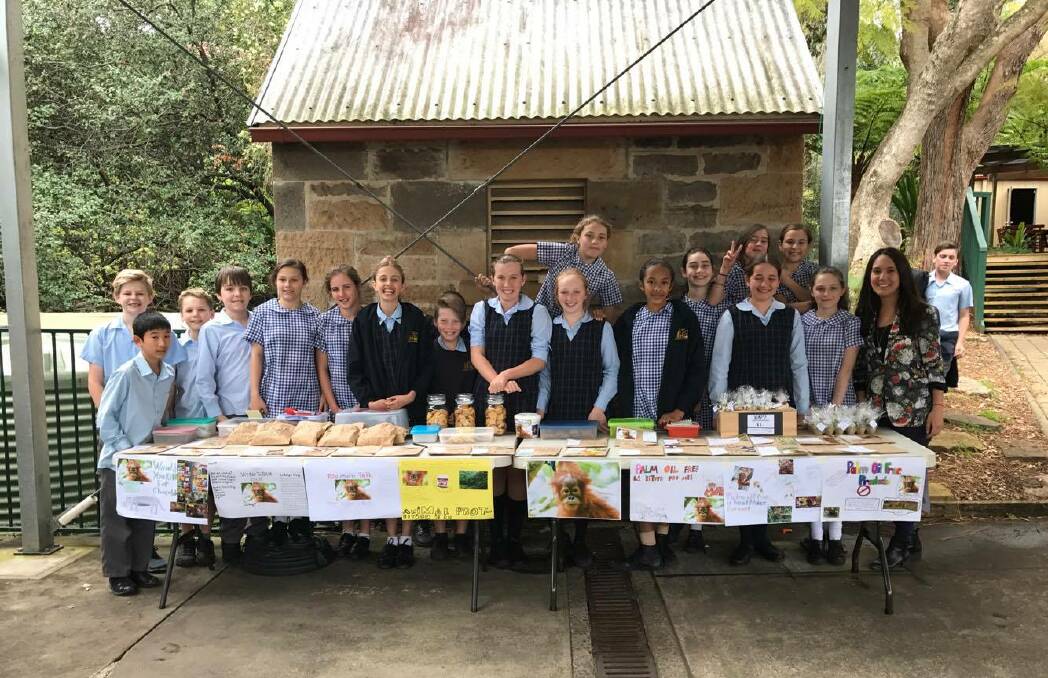 Global citizens: The Mt Keira Demonstration School students with their palm oil-free stall, doing their bit to save the habitat of the orangutan.