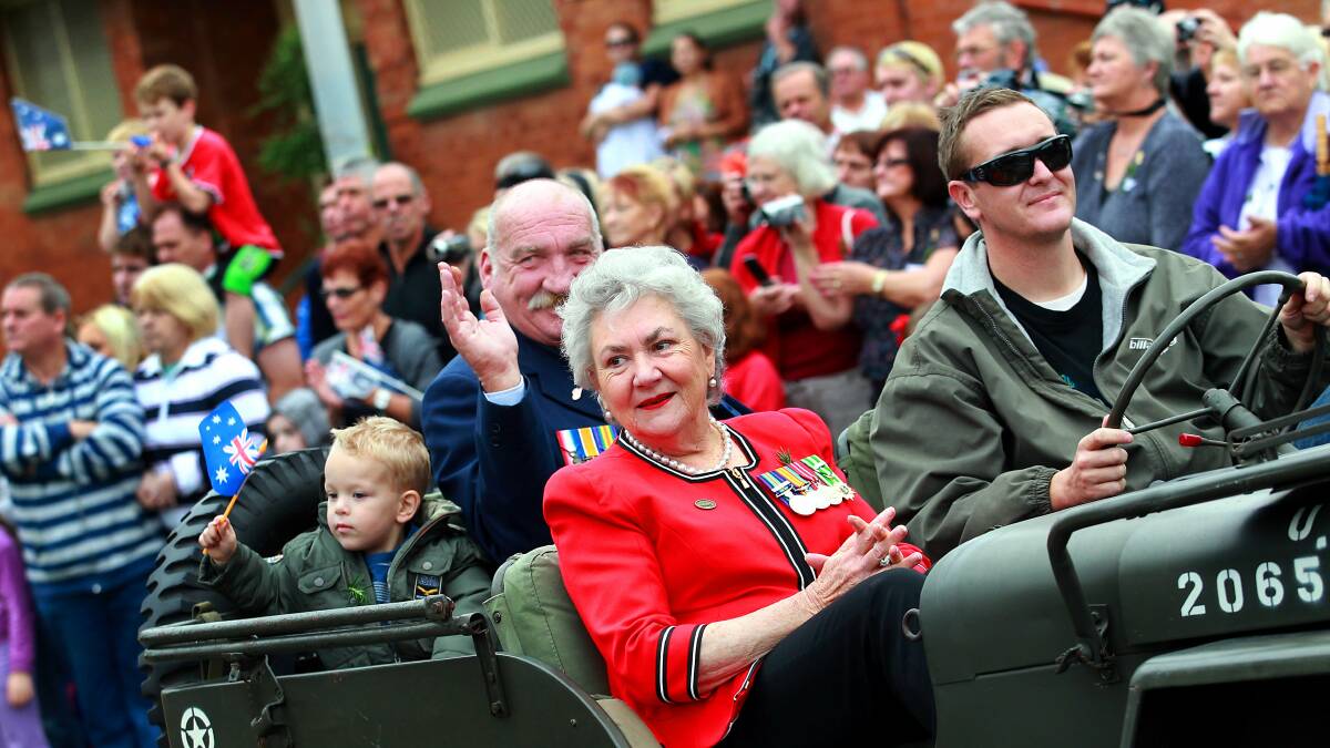 Capt Maureen Patch is driven through Wollongong in the Anzac Day march of 2011.