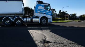 A truck using the road to the Bass Point quarry where the surface has been damaged. Picture by Adam McLean