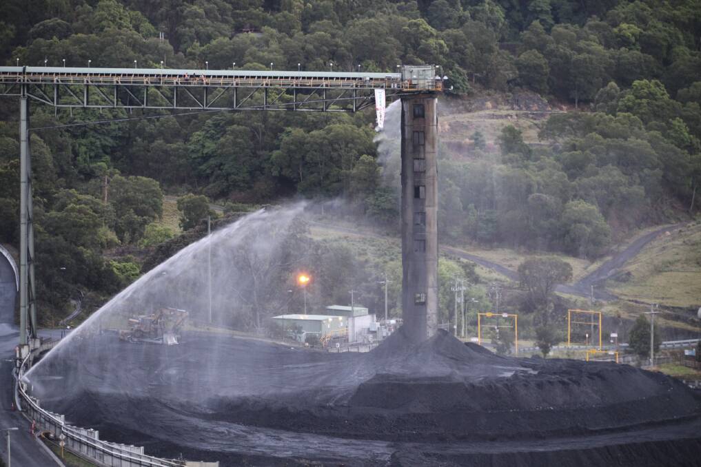 South32's Dendrobium mine, where a protester hung a banner reading 'Water not Coal' from a gantry in 2019. The company has pledged to build no new coal mines. Picture supplied.