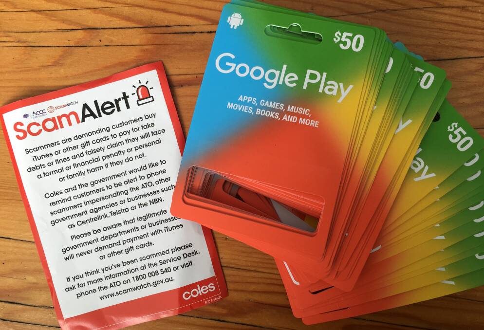 BONUS PRIZE: Spend all your money getting scammed on Google cards at Coles, and we'll give you this nice flyer warning about scams using Google cards. Picture: Ben Langford.