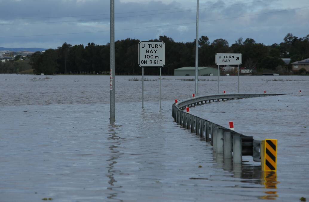 INLAND SEA: Cessnock Rd at Maitland was cut as the area was again inundated by flood waters, this time on July 7. Picture: SIMONE DE PEAK.