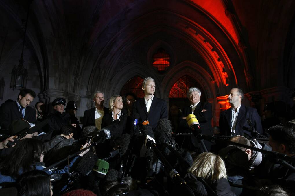 ROUND 1: Jennifer Robinson, Julian Assange and Geoffrey Robertson outside the High Court in 2010. Picture: AP.