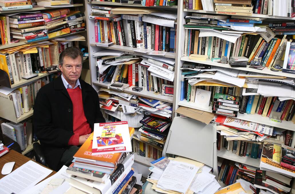 Ashbolt in his office where he received students amid his own library of various works.