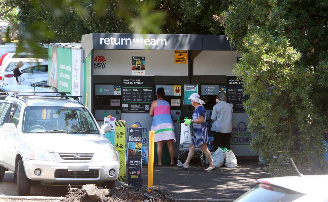 EARNED IT: People using the popular Return and Earn station at Corrimal on Wednesday. Picture: SYLVIA LIBER.