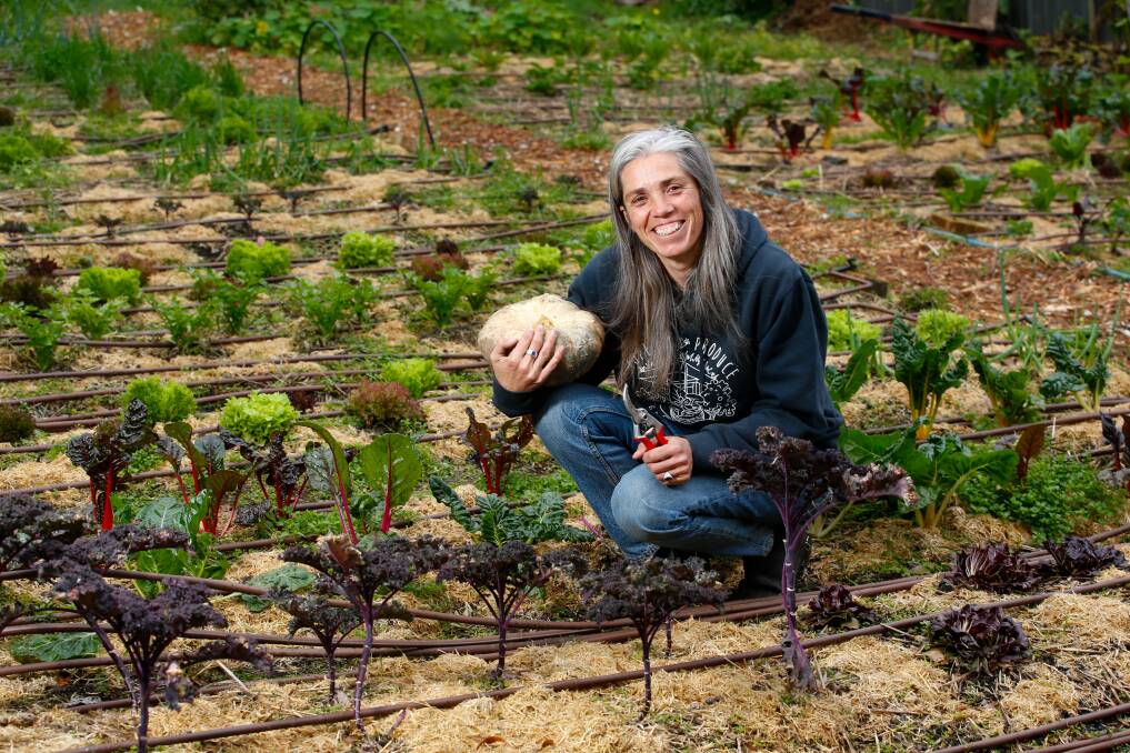 Sarah Anderson in her suburban farm, where the bitter lettuces and brassicas are still delivering. Pictures: ANNA WARR.