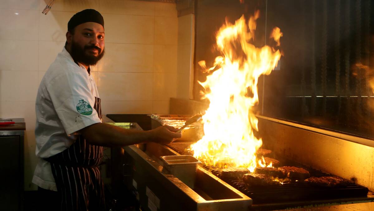 Chef Savi Dutta on the fiery grill at new Wollongong steakhouse Meat & Grain Co on Kembla St in the CBD. Pictures by Sylvia Liber.