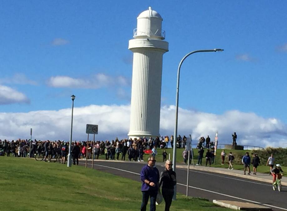 The protesters showed their feelings by getting really close together at the lighthouse.