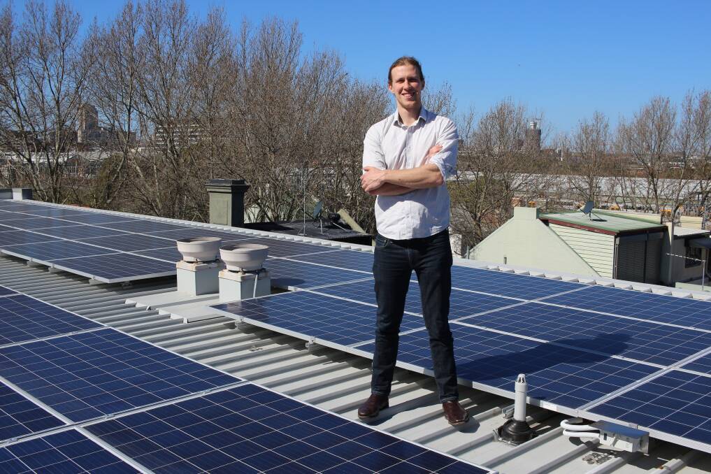 Sunny outlook: Bjorn Sturnberg on the roof of the Stucco Co-operative, where he spearheaded his first installation of a solar and energy storage system, on Thursday.