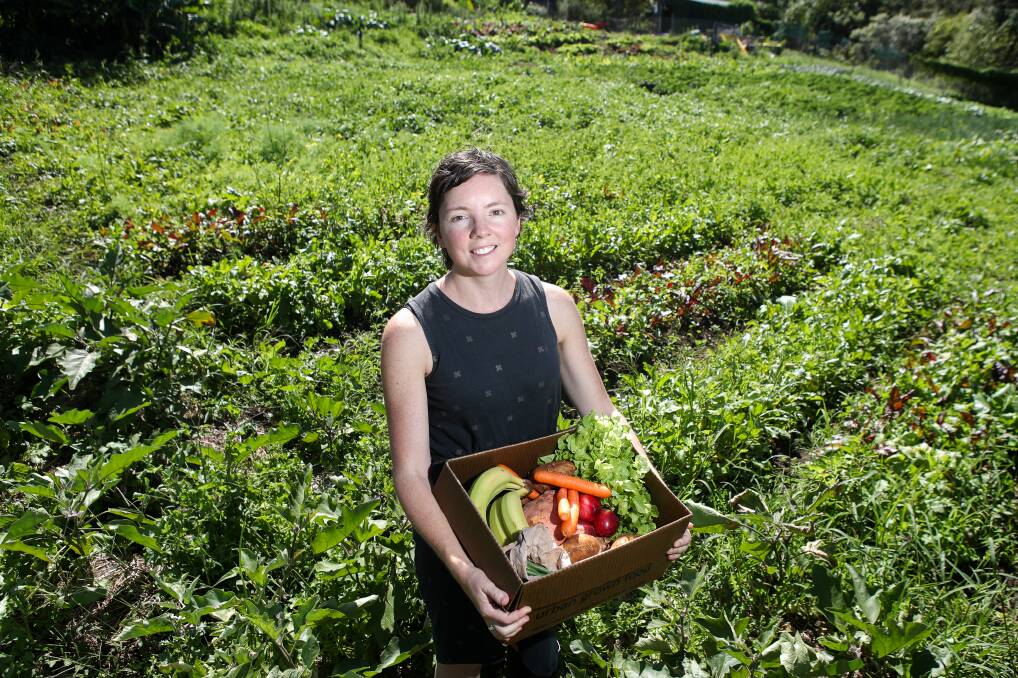 CONNECTED: Manager Kylie Flament with a box of fresh produce at the Port Kembla farm. The social enterprise has just been recognised with a Commonwealth Innovation prize. Picture: ADAM McLEAN.