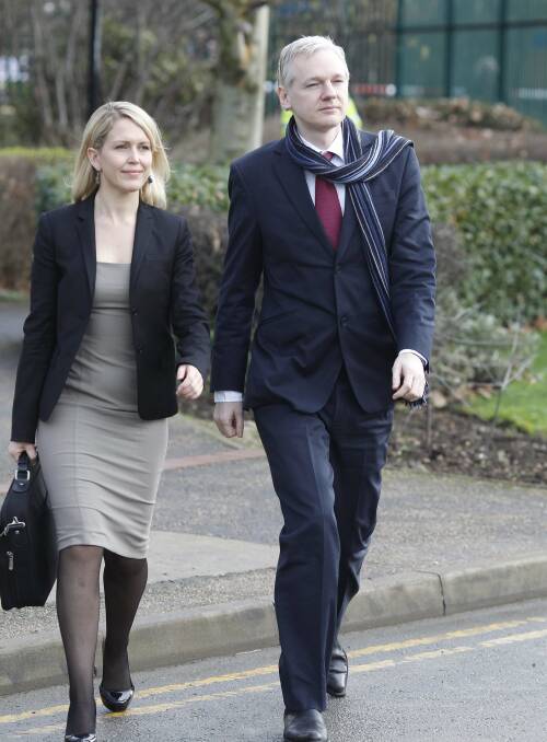 Robinson with Wikileaks founder Assange arriving at Belmarsh Magistrates Court in 2011. Picture: EPA.