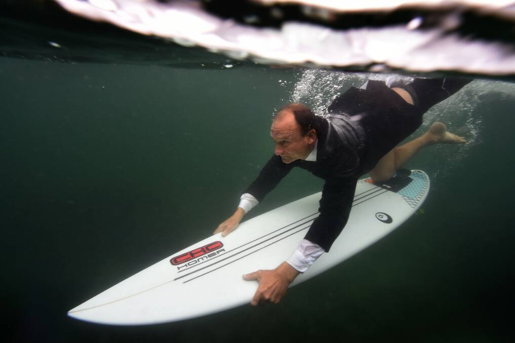 DOWN HOMER: Shellharbour's surfer mayor goes in head first. Picture: SYLVIA LIBER