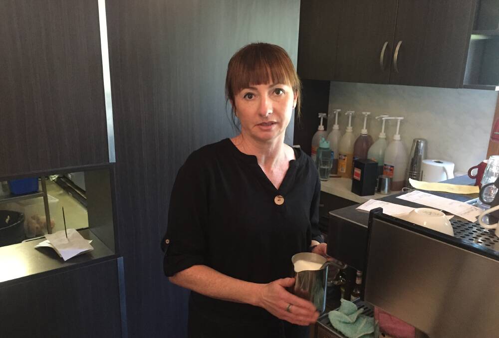 COMMUNITY HUB: Jo Draper behind the coffee machine at Palms cafe. Picture: Ben Langford
