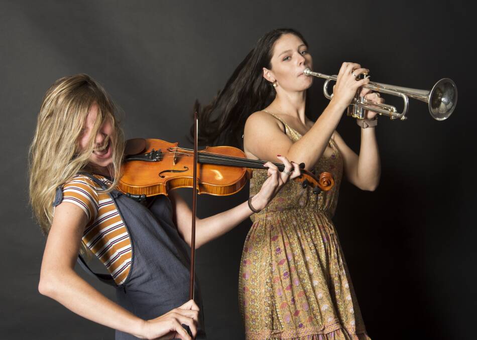 FUN TIMES: The Con Artists members Cara Crinnion (violin) and Matilda Davis-Raiss (trumpet). Picture: Brien Lefoe.