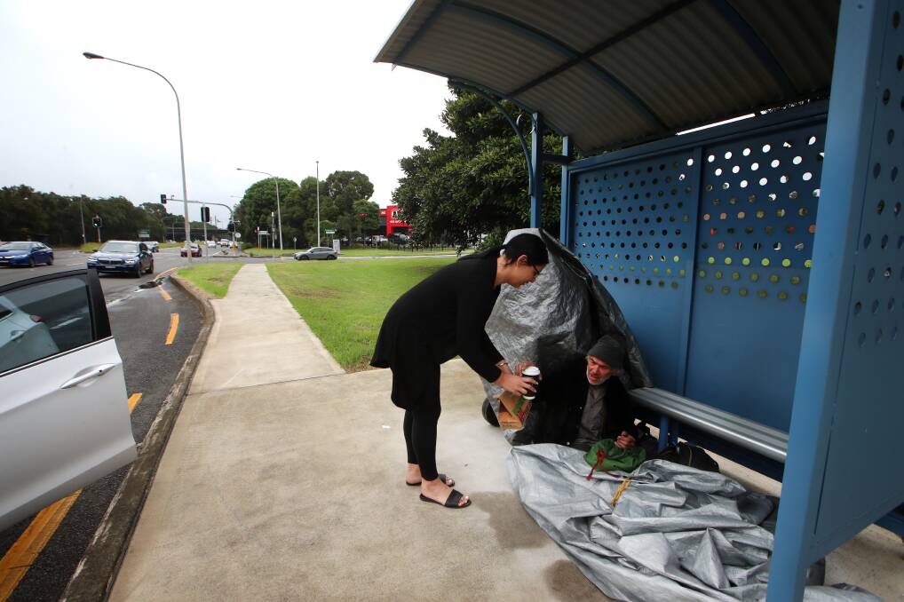 HELPING HAND: A man was taking shelter under a tarp on Springhill Rd when a stranger stopped and brought him food and coffee. Picture: SYLVIA LIBER.