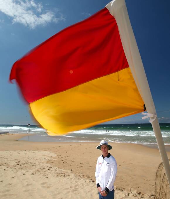 On guard: Wollongong council lifeguards boss Jason Foye at North Gong beach. As days warm up, aerial shark patrols and beach lifeguards have started their work for the summer season. Picture: KIRK GILMOUR