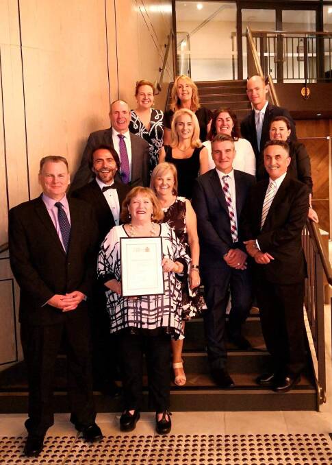 STANDING PROUD: Shellharbour general manager Carey McIntyre (front left), Mayor Marianne Saliba (front centre) with councillors, staff leaders and the award.