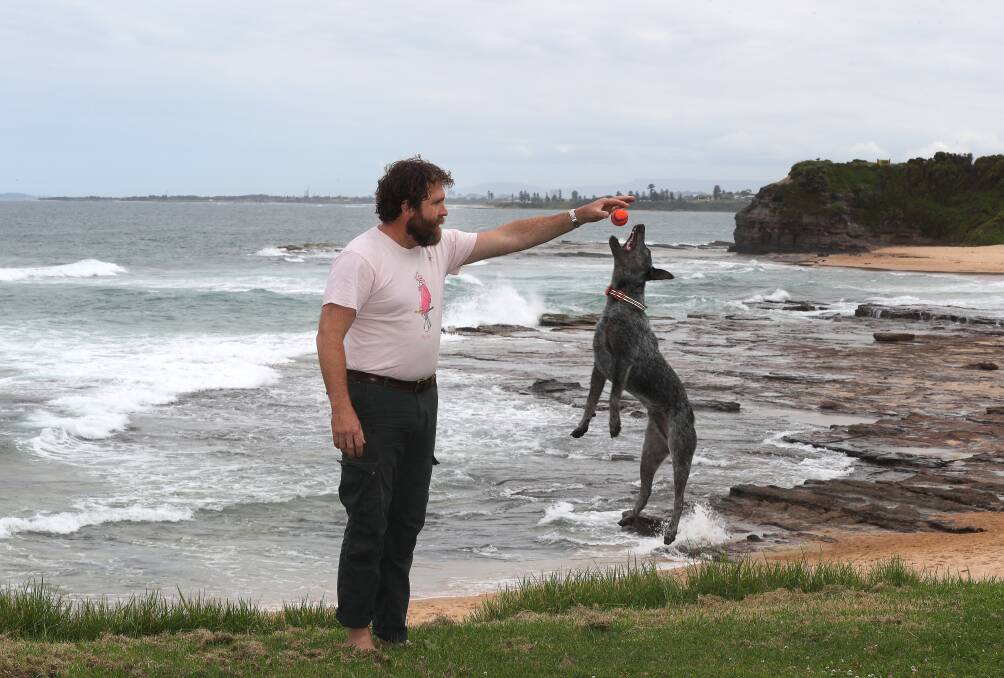 TIME TO TAKE THE LEAP: Saul Griffith with his blue heeler Radar at Little Austinmer Beach. Picture: ROBERT PEET.