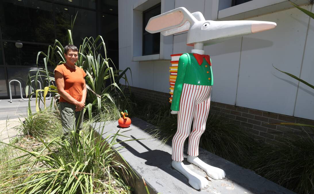 Dr Kim Williams on campus at the University of Wollongong, with sculpture titled Midnight by artist Joan Ross. Picture by Robert Peet.