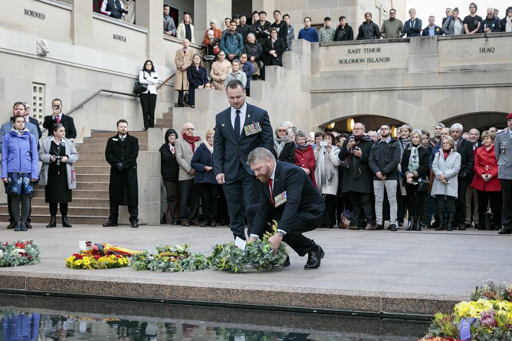 With fellow former commando Mick Bainbridge laying a wreath at the Australian War Memorial in Canberra last August.