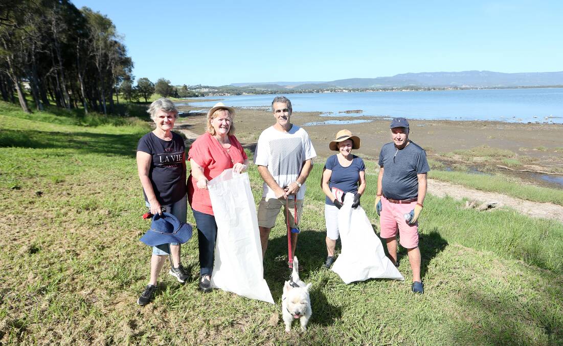 GREENING: John Davey (centre) and Mariannne Saliba (red shirt) cleaning up the Lake Illawarra foreshore in 2020.