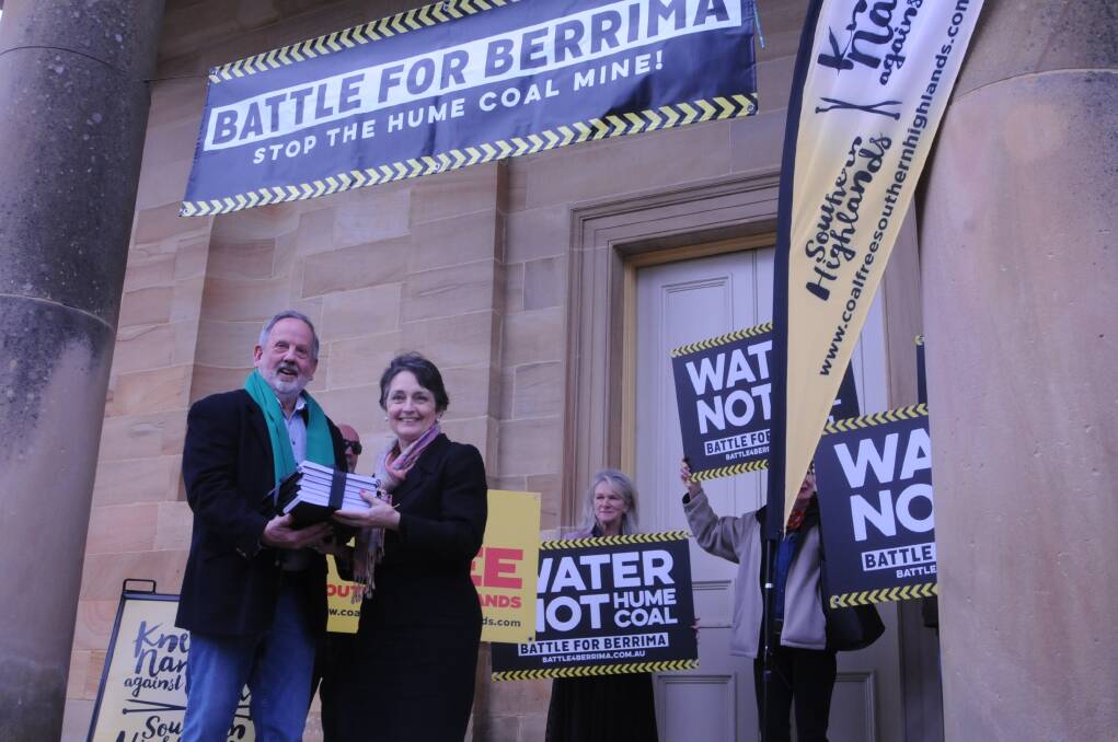 Water shortened: Ken Wilson presents a petition to NSW MP Pru Goward, who opposes the mine.