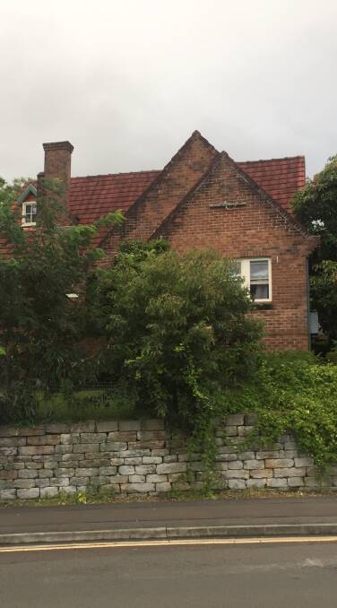 GOING: The Gables in Thirroul with the sandstone wall at front