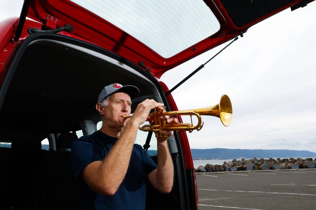 Eric Dunan practises his trumpet at the Bellambi boat ramp. Picture by Anna Warr.