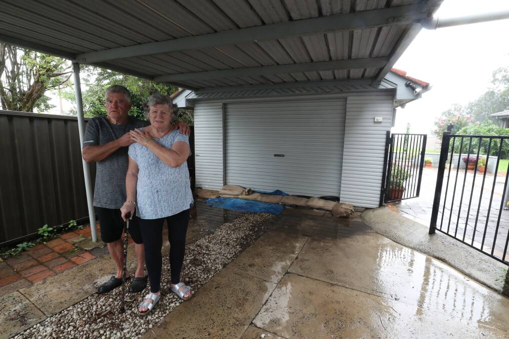 Mike Taylor and Carol Maloney have sandbagged their garage in Oak Flats. Picture: Wesley Lonergan