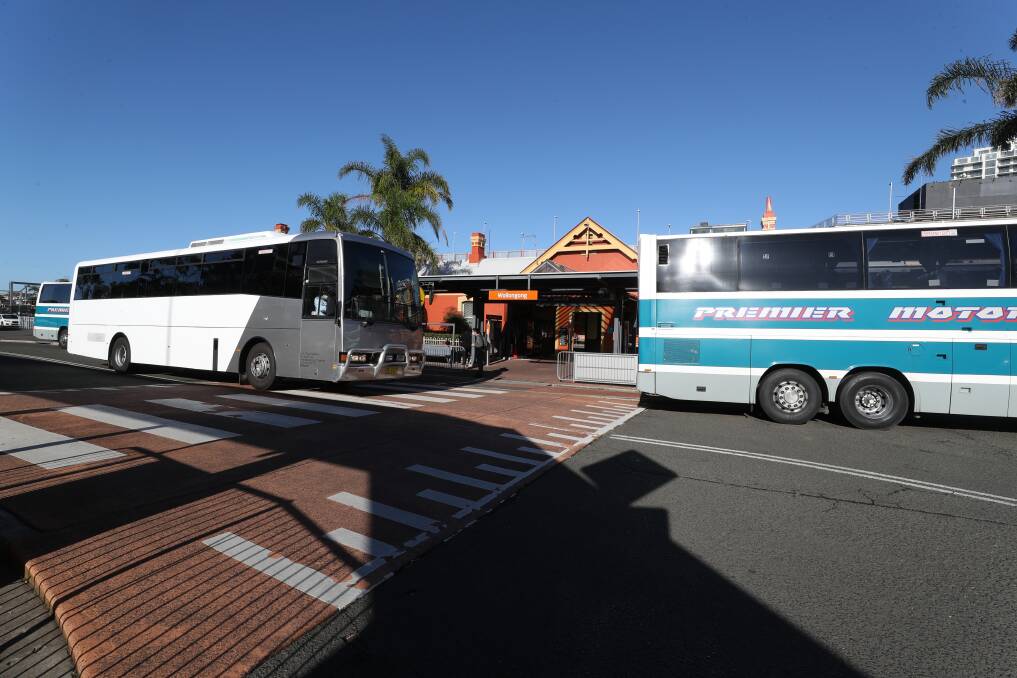 NO TRAINS: Replacement buses line up outside Wollongong Railway Station. Picture: Robert Peet