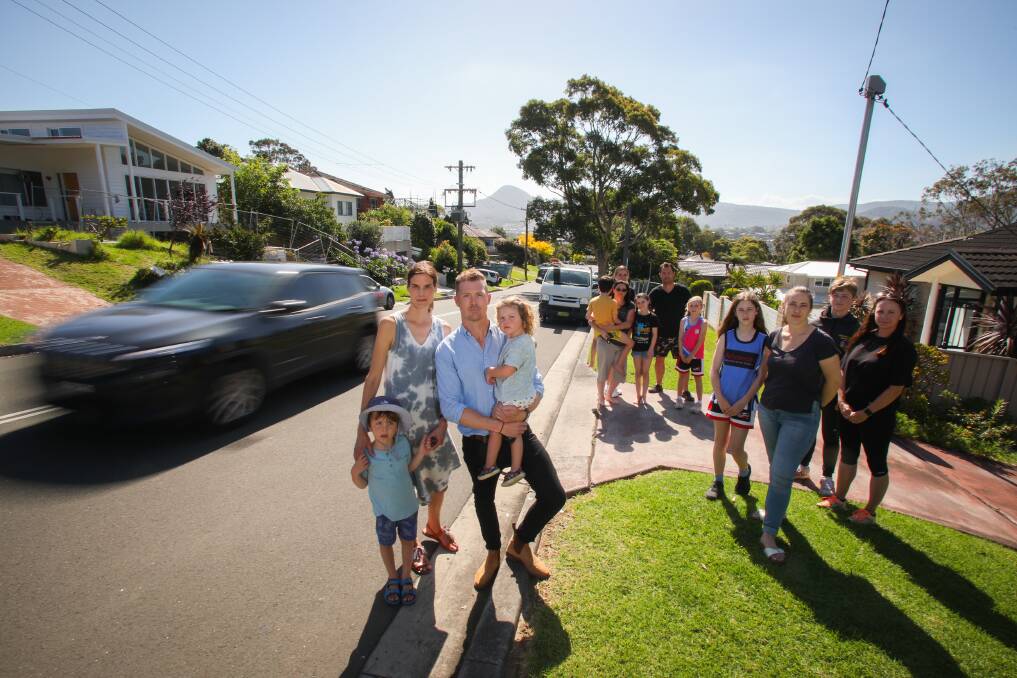 Laura and Matt McCrohon, with children Finn and Evie and other concerned residents, are calling for action on pedestrian safety along The Avenue. Picture: Wesley Lonergan