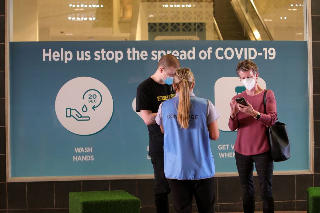 JABS: People check in to receive their COVID-19 shot at the Illawarra Shoalhaven Mass Vaccination Centre in Wollongong. Picture: Sylvia Liber