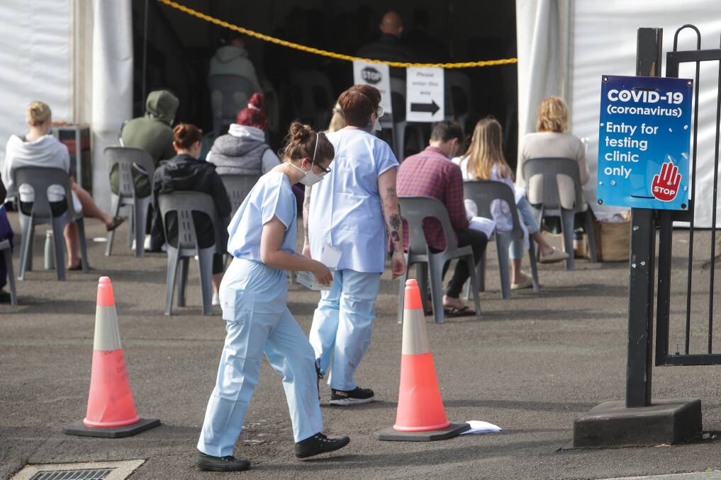 Staff and community members outside the COVID screening clinic at Wollongong Hospital. Picture: Adam McLean