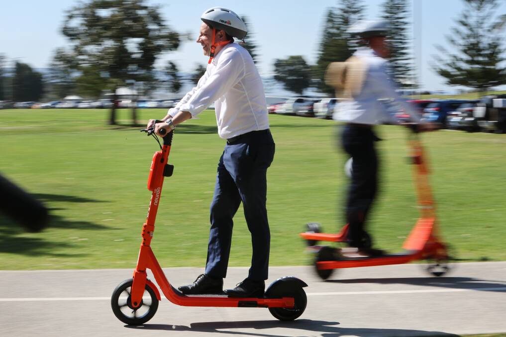Wollongong MP Paul Scully rides an e-scooter. Picture by Sylvia Liber