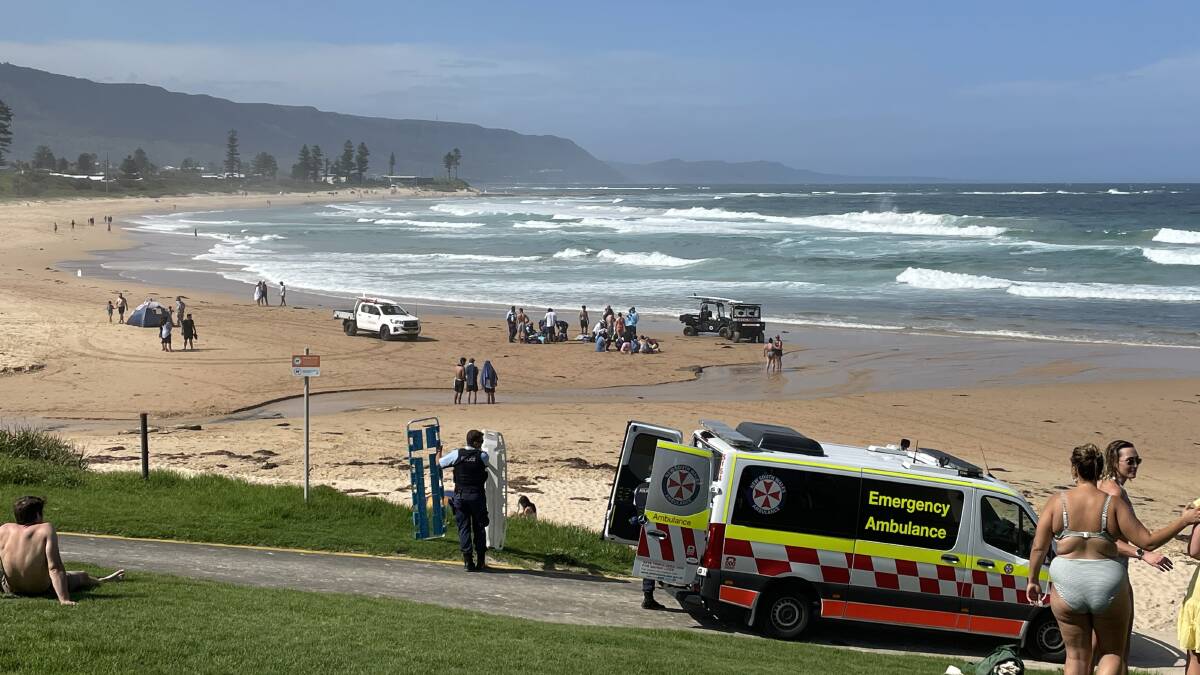 Emergency services at Woonona Beach, where life savers have pulled three people from the water. Picture: Gayle Tomlinson