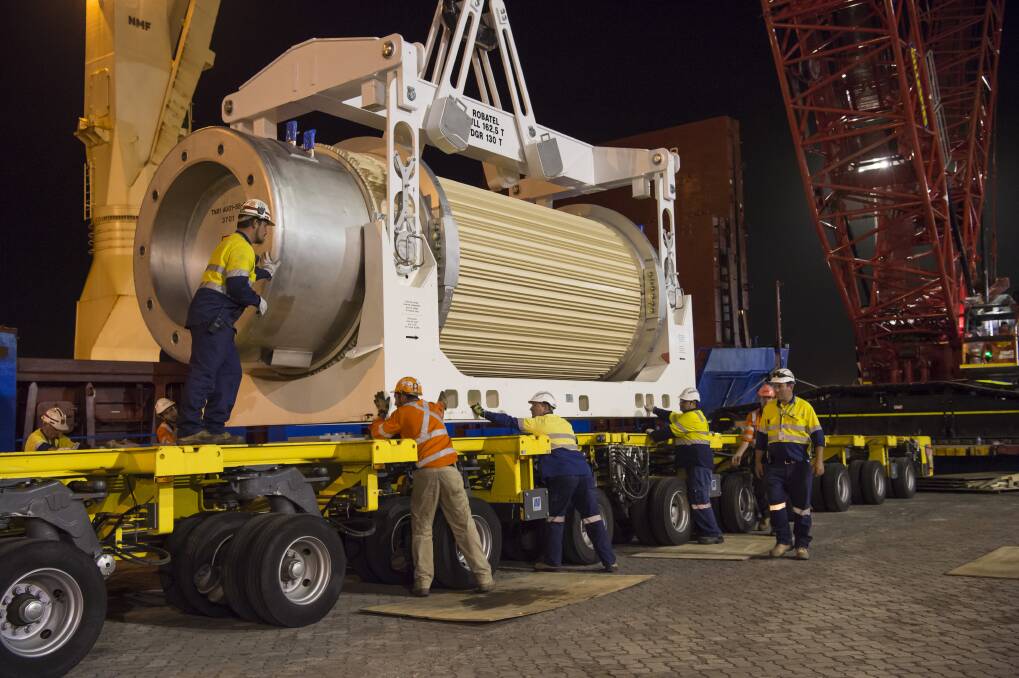 Port Kembla dock workers unloading a container of nuclear waste onto a truck in 2015. Picture: Supplied