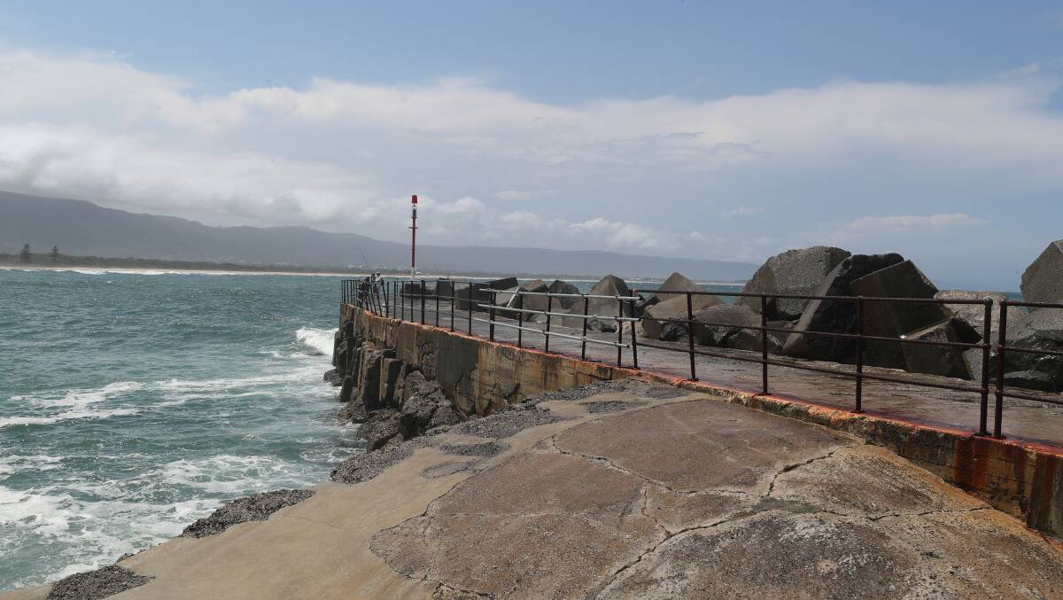 New fencing fills the gap on Wollongong Harbour's breakwater. Picture by Robert Peet